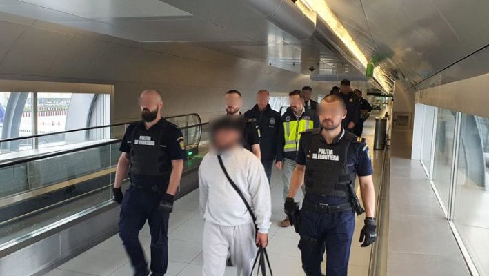 Un român căutat de autorităţile spaniole pentru omor a fost adus pe Otopeni sub escorta autorităților americane