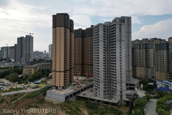 Declinul de pe piaţa imobiliară chineză a continuat în luna mai
