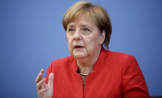 De ce tremură Angela Merkel? Teorii ale presei şi specialiştilor